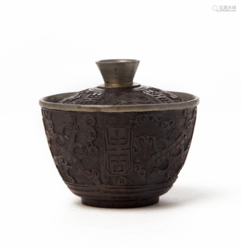 A CARVED COCONUT SHELL BOWL AND COVER