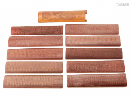 A GROUP OF ELEVEN WOOD WRIST RESTS