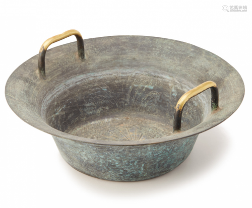 A LARGE TWIN HANDLED METAL BOWL