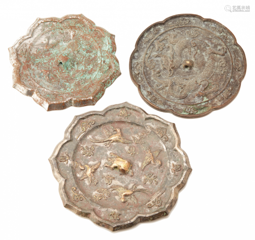 A GROUP OF THREE SMALL OCTAFOIL BRONZE MIRRORS