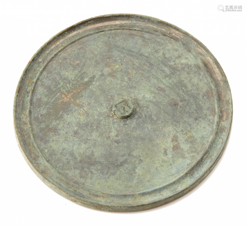 A LARGE PLAN CIRCULAR BRONZE MIRROR