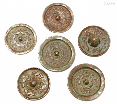 A GROUP OF SIX SMALL BRONZE MIRRORS