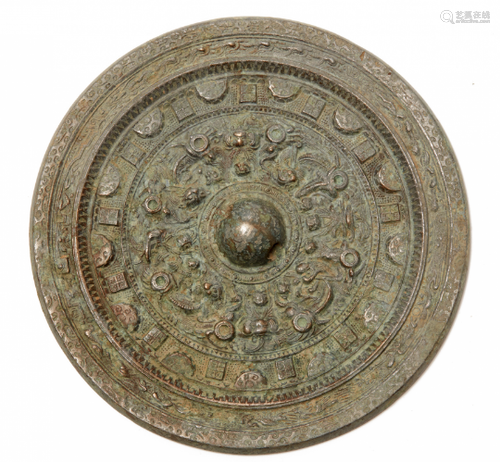 A CIRCULAR BRONZE MIRROR WITH MYTHICAL CREATURES