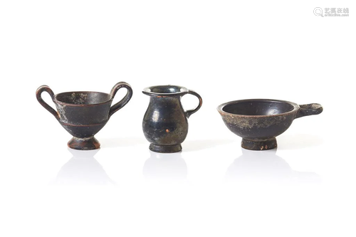 THREE ANCIENT BLACK GLAZED TERRACOTTA CUPS