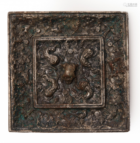 A SMALL SQUARE LION AND GRAPEVINE BRONZE MIRROR