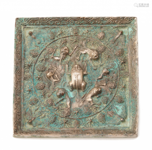 A SQUARE BRONZE LION AND GRAPEVINE MIRROR