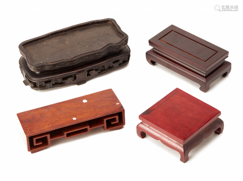 FOUR ASSORTED RECTANGULAR CARVED WOOD STANDS