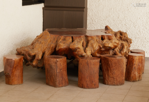 *A LARGE ROOT WOOD TABLE WITH EIGHT STOOLS