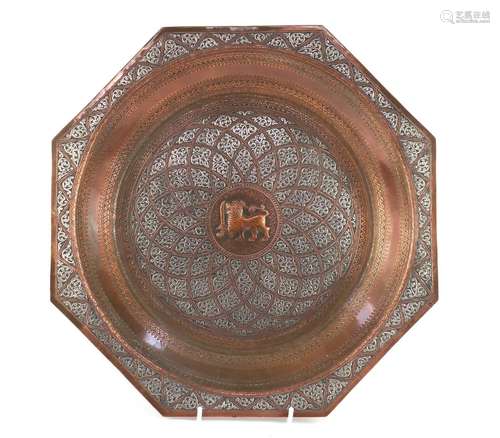 Burmese copper tray embossed with a mythical dragon and having silver foliate overlay, 35cm high :