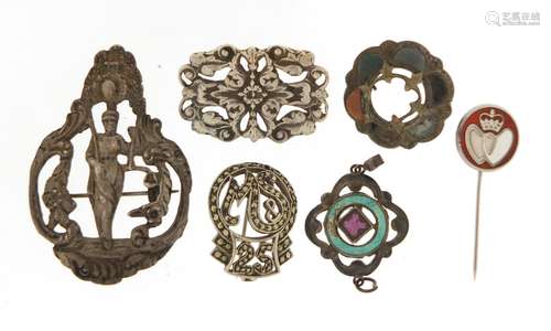 Jewellery including three silver brooches, and a silver enamel pendant, the largest 5.5cm in