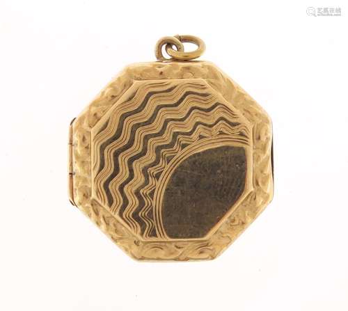 9ct gold back and front octagonal locket with engine turned decoration, 2.2cm in diameter, 4.3g :