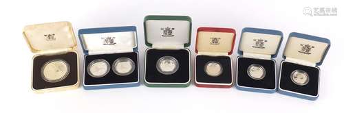 Silver proof coins with cases comprising three one pounds, ten pence two coin set, ten pence and