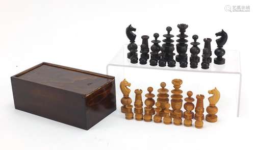 Boxwood and ebonised chess set housed in a stained pine case, the largest piece 8.5cm high : For