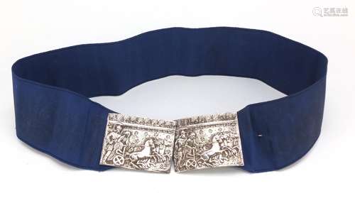 Silver coloured metal two piece nurse's buckle decorated in relief with figures in a chariot, the