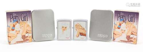 Two Zippo Petty Girl pin up lighters with cases and cardboard slips : For Further Condition