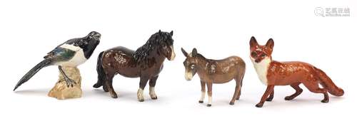 Four Beswick collectable animals comprising a fox, magpie, donkey and pony, the largest 25cm