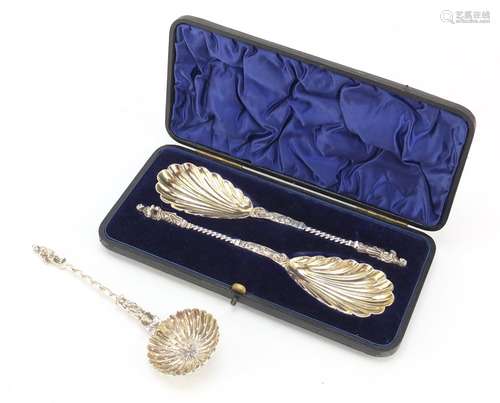 Pair of Victorian silver plated apostle spoons with gilt interiors and a similar sifting spoon,