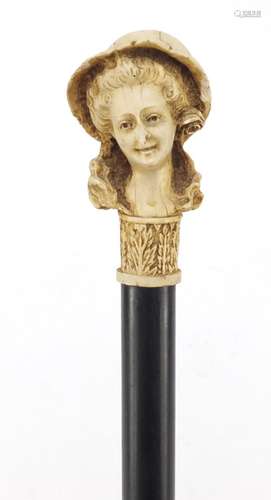 Ebonised walking stick with figural pommel, 92cm in length : For Further Condition Reports Please