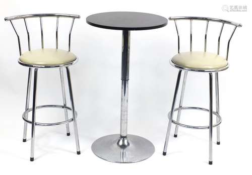 Adjustable pedestal table and two chromed breakfast stools with cream faux leather seats, the