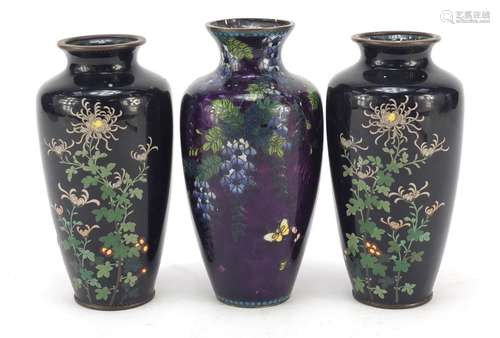 Three Japanese cloisonné vases including a pair enamelled with blossoming flowers, the largest