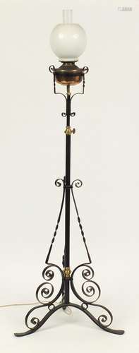 Victorian wrought iron adjustable floor standing oil lamp, (converted to electric use) 140cm