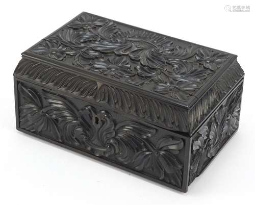 Anglo Indian Ceylonese ebony casket profusely carved with flowers, 11.5cm H x 24cm W x 15.5cm D :