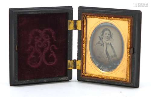 Victorian oval photograph of a female housed in a Bois durci frame, the gilt mount impressed Kimball