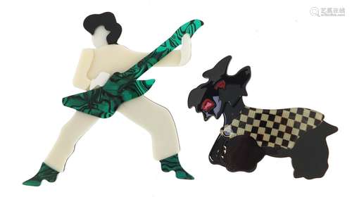 Two Lea Stein style brooches in the form of a rock star and scottie dog, the largest 9cm high :