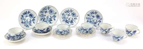 Meissen cups and saucers hand painted in the Blue Onion pattern comprising seven cups and six