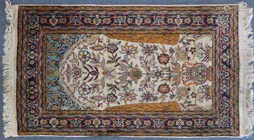 Rectangular Persian Qum silk rug having an all over floral design, 160cm x 91cm : For Further