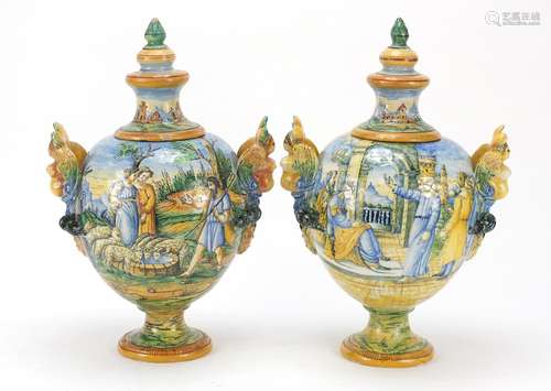 Pair of 19th century Italian Maiolica pottery vases and covers with twin figural handles, each