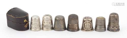 Seven Victorian and later silver thimbles, one with a Sidney Smith leather case, various