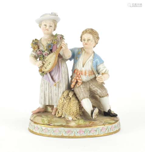 19th century Meissen figure group of a boy and girl playing a mandolin, blue crossed sword marks and