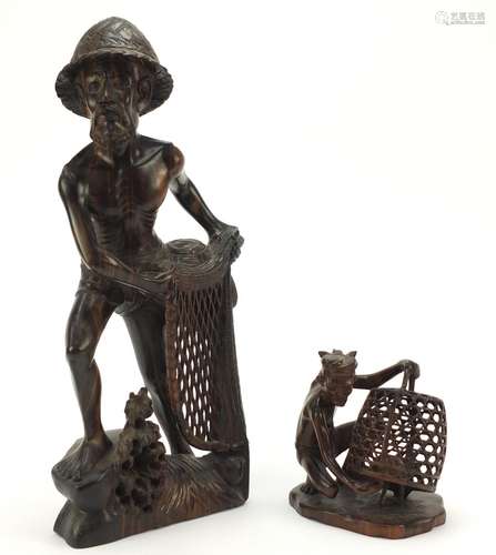 Two well carved Indonesian hardwood figures including a fishermen, the smallest signed to the