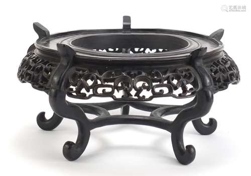 Good Chinese hardwood stand carved with bats and foliage, 16cm high x 30.5cm in diameter : For