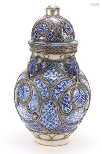 Large Middle Eastern four handled vase with twin handles and applied silver coloured metal mounts,