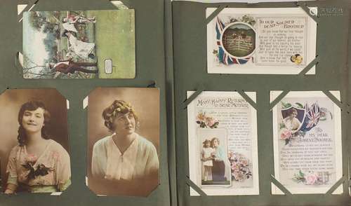 Edwardian and later comical sweetheart and greetings postcards arranged in an album, including First