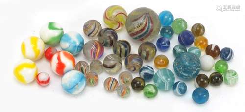 19th century Laticcinio cane marbles with some others, the largest approximately 3.6cm in diameter :