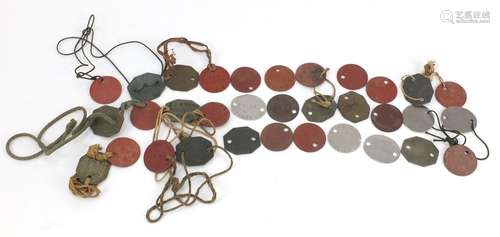 Collection of military interest dog tags, predominantly leather : For Further Condition Reports