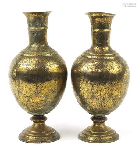 Large pair of Indian brass vases engraved with figures, animals and flowers, each 53cm high : For