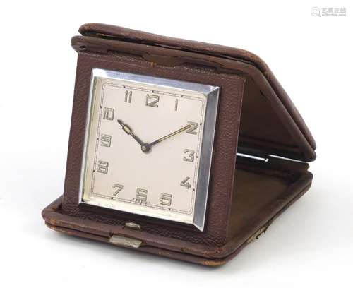 Art Deco folding travel clock with silvered dial, having Arabic numerals, 9.5cm x 9.5cm : For