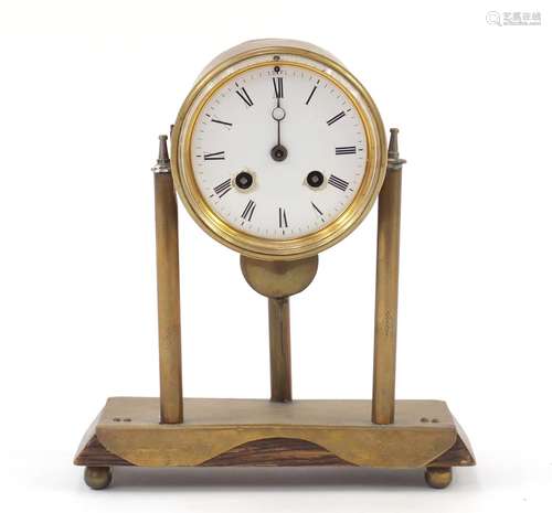 Continental brass three pillar mantle clock with enamel dial and Roman numerals, 25cm high : For