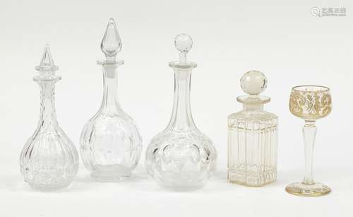 Glassware including a Continental etched and hand gilded glass and four decanters with stoppers :