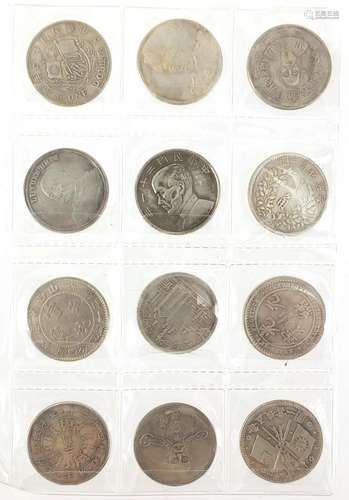 Twelve Chinese silver coloured metal coins : For Further Condition Reports Please Visit Our Website,