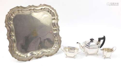 Three piece Sheffield silver plated tea set and a tray with engraved crest, the tray 42.5cm x 42.5cm