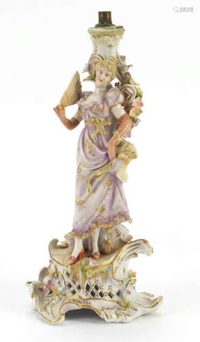 German porcelain figural candlestick encrusted with flowers by Plaue, numbered 576 75, 27.5cm high :