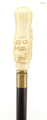 Hardwood walking stick with carved bone pommel in the form of a Chinese elder holding a tortoise,