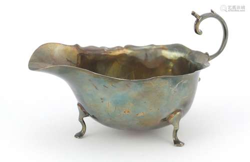 George V silver sauce boat raised on three feet, by Adie Brothers Ltd, Chester 1926, 14cm in length,