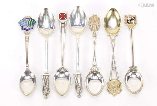 Seven golfing interest silver teaspoons, some with enamelled terminals, various hallmarks, the