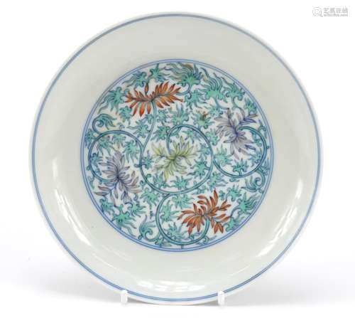 Chinese doucai porcelain dish, hand painted with flowers amongst scrolling foliage, six figure